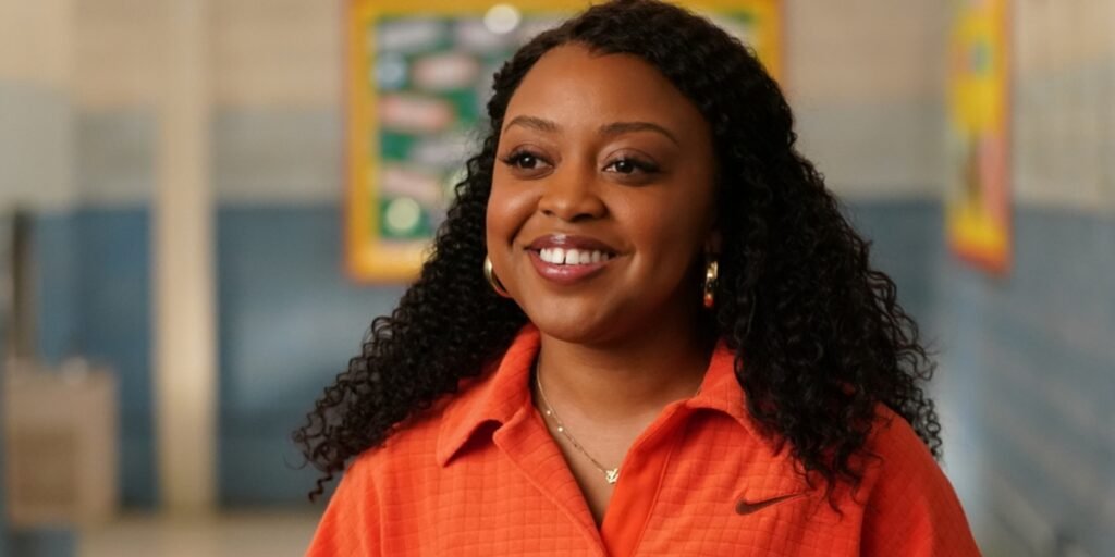 Janine Teagues (Quinta Brunson) smiling in the halls of Abbott Elementary. | Agents of Fandom