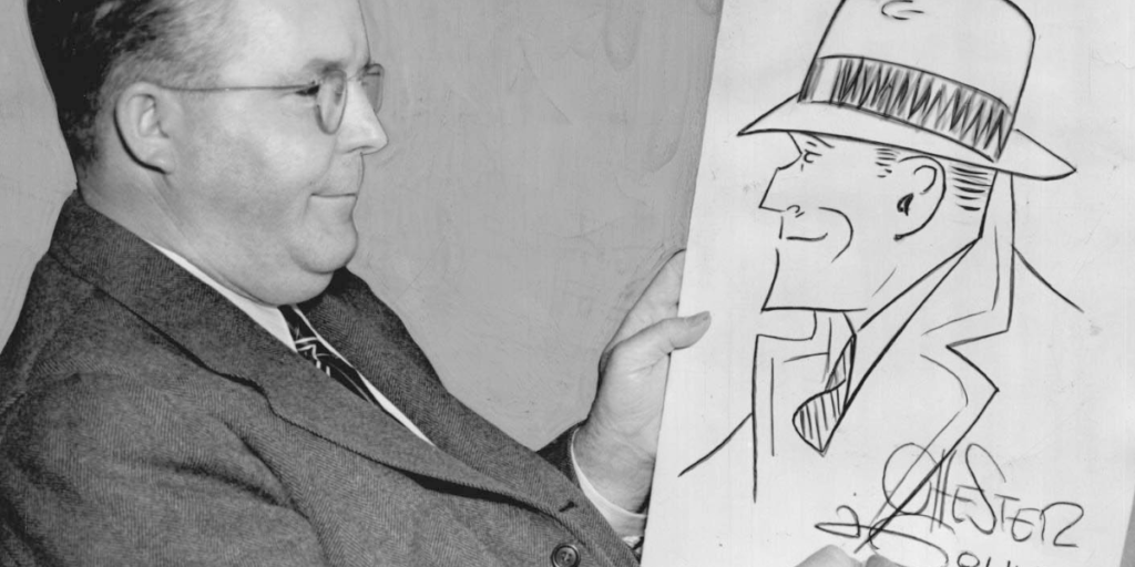 A photo of cartoonist Chester Gould, the creator of Dick Tracy, holding up one of his sketches of the iconic detective | Agents Of Fandom