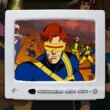 A computer screen showing Cyclops from X-Men '97 and mutants in the background | Agents of Fandom