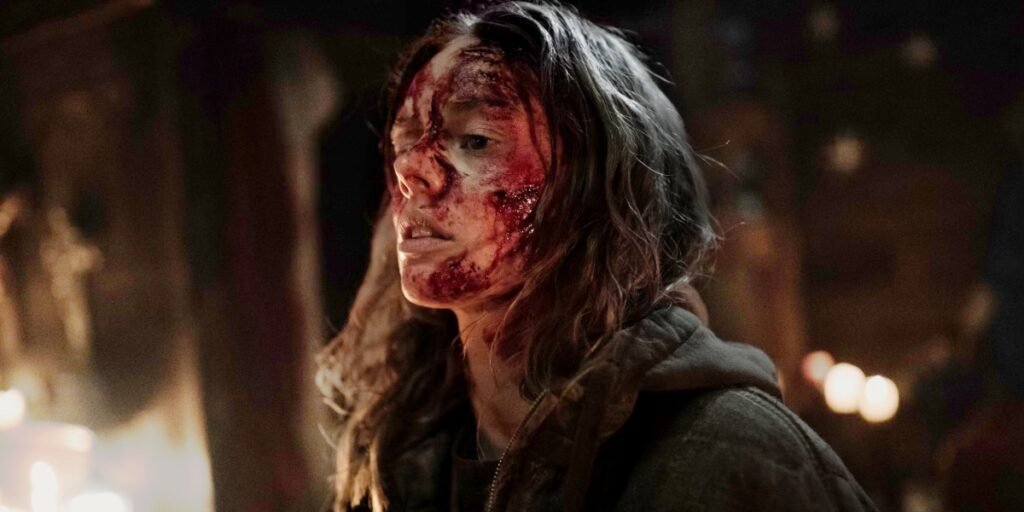 A bloodied Azrael (Samara Weaving) rests after fighting her way to freedom in Azrael. I Agents of Fandom