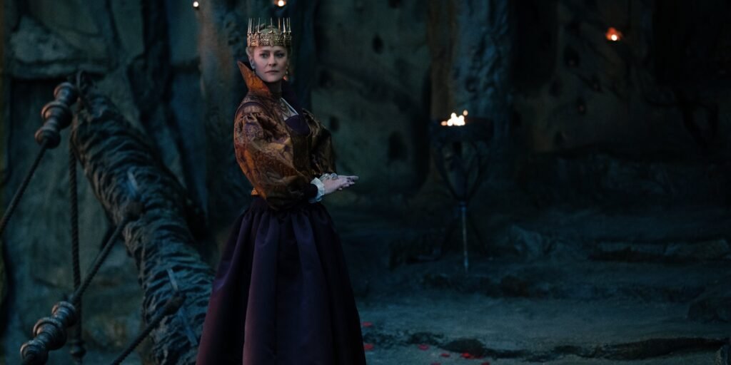 Robin Wright as Queen Isabelle in Damsel dressed in a gown wearing a crown | Agents of Fandom