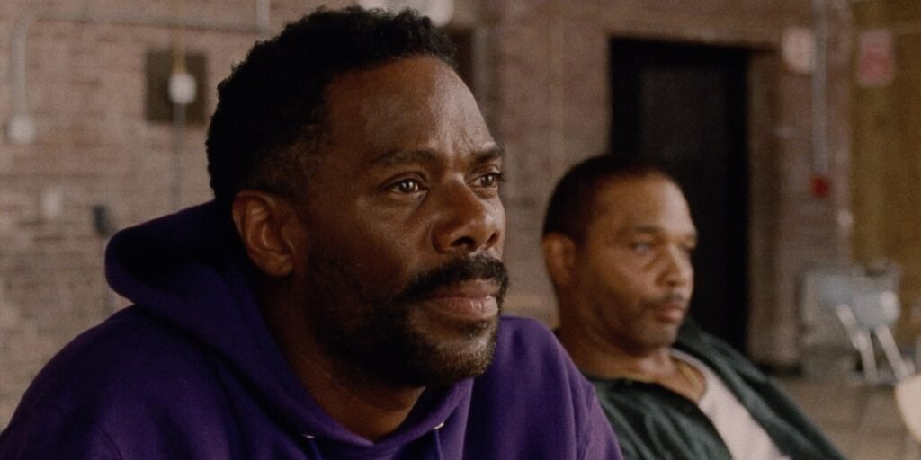 Divine G (Colman Domingo, left) sits forward in a purple hoodie during a rehearsal as Divine Eye (Clarence Maclin, right) leans back in Sing Sing