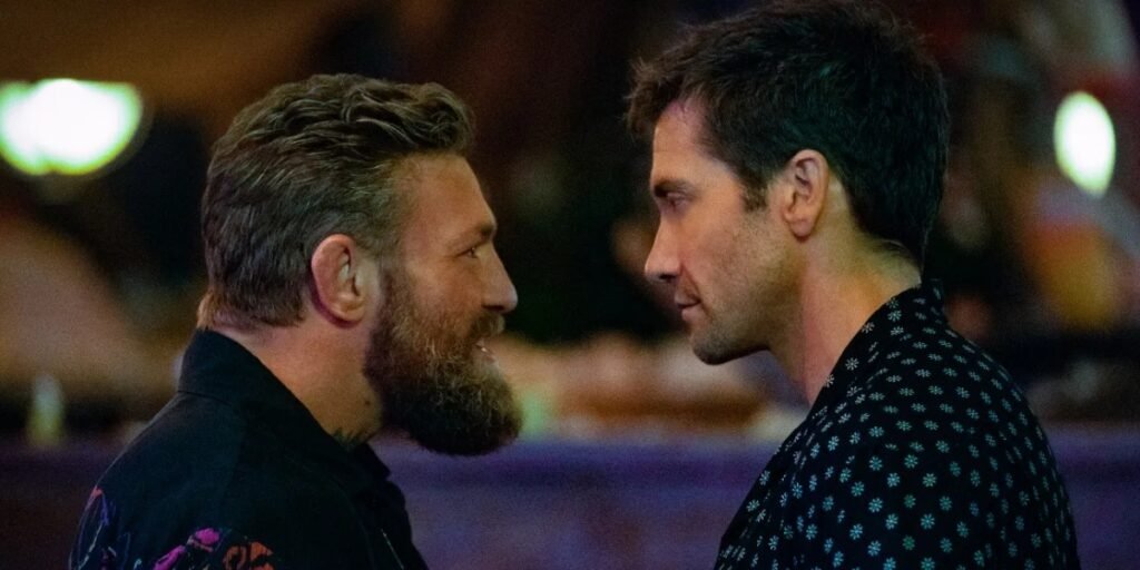 Knox (Conor McGregor, left) squares up face to face against Dalton (Jake Gyllenhaal, right) before they throw punches in the remake of Road House I Agents of Fandom