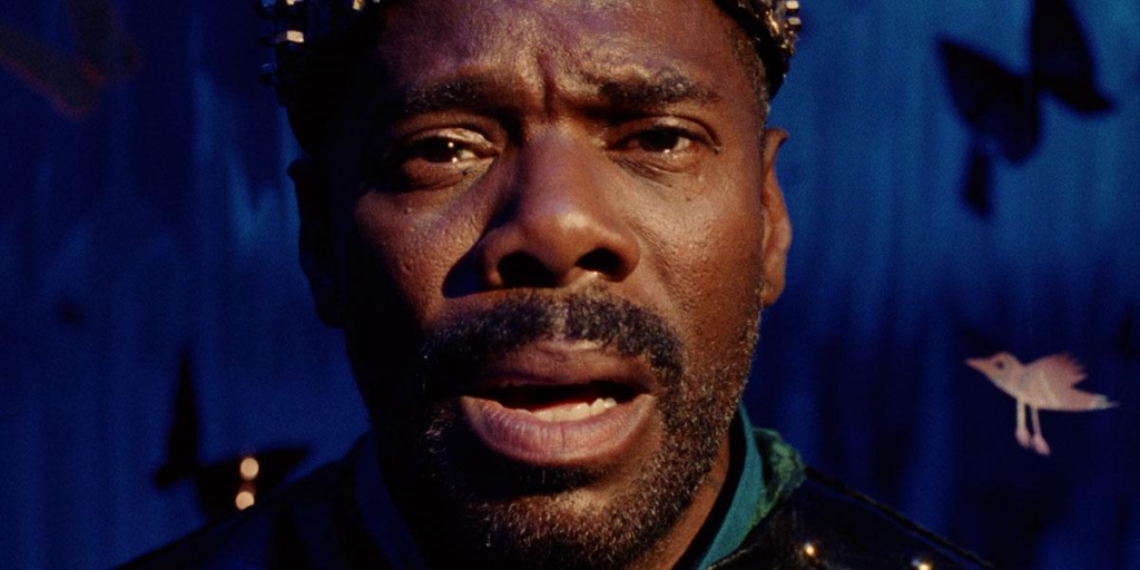 'Divine G' (Colman Domingo) stares into the camera, mouth ajar, as he struggles with self-love and past trauma while performing a play in Sing Sing. Image Credit: A24