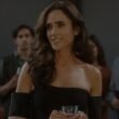 Jennifer Connelly holding a drink at a party with people behind her in Dark Matter Episode 2 | Agents of Fandom