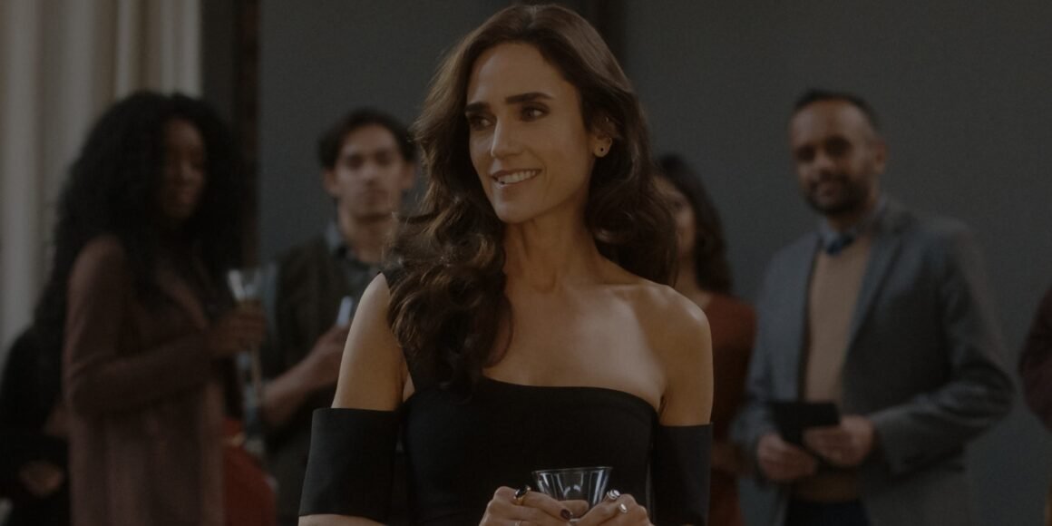 Jennifer Connelly holding a drink at a party with people behind her in Dark Matter Episode 2 | Agents of Fandom