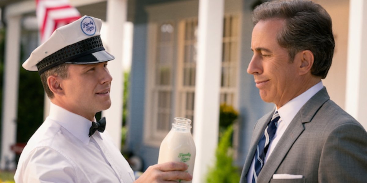 Christian Slater hands Jerry Seinfeld a jar of milk in Unfrosted | Agents of Fandom