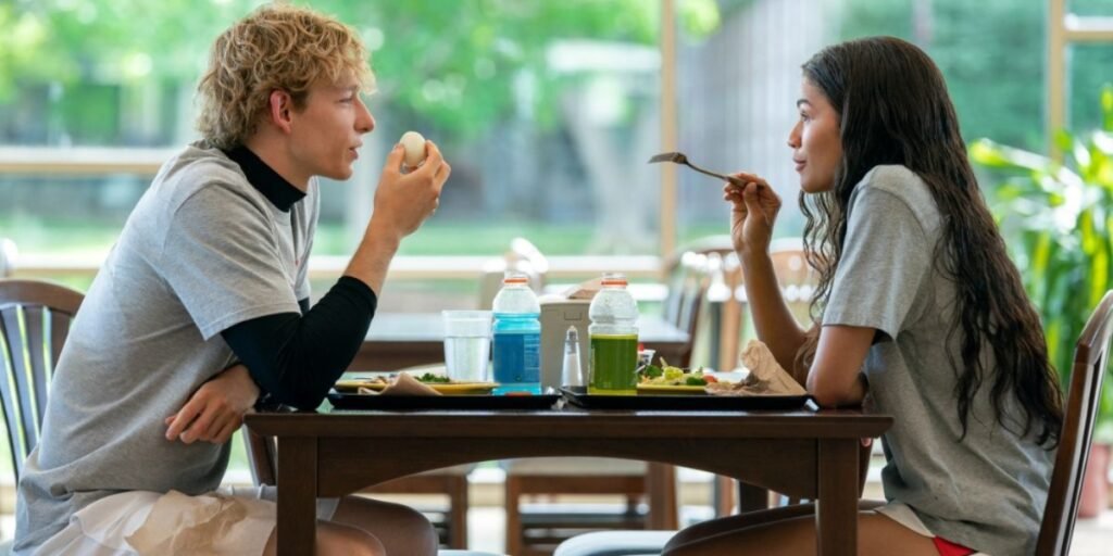 Mike Faist and Zendaya sitting at a table having lunch in Challengers | Agents of Fandom