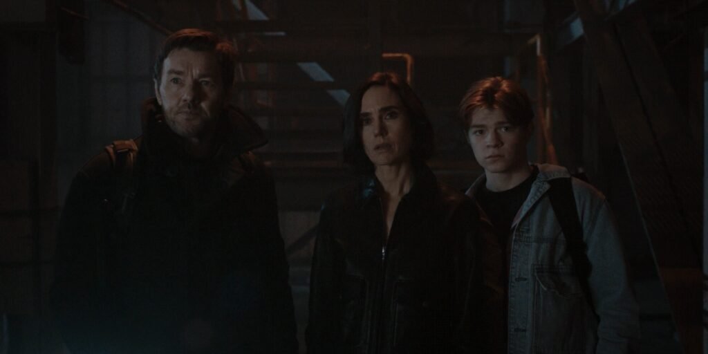 Jason, Daniela, and Charlie standing near the box staring at all the other Jasons in Dark Matter Episode 9 | Agents of Fandom