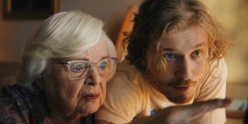 Thelma (June Squibb, left) points to a computer screen as Daniel (Fred Hechinger, right) tries to help her figure something out I Agents of Fandom