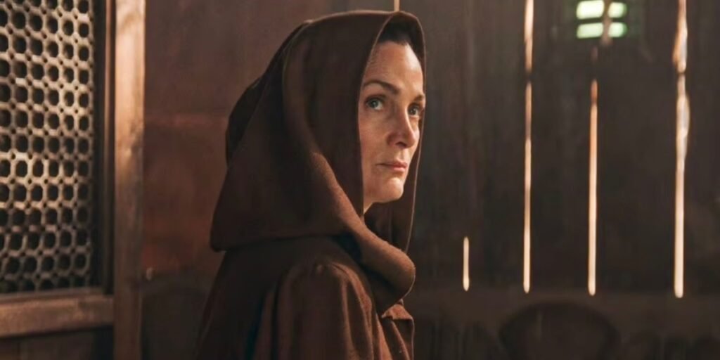 close up of Carrie-Anne Moss staring to the side as Jedi Master Indara in The Acolyte | Agents of Fandom