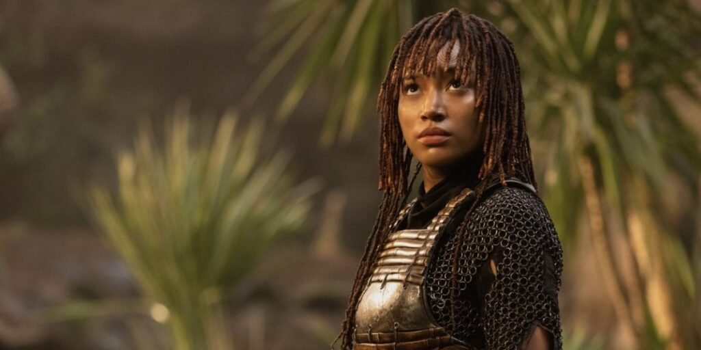 A still of Amandla Stenberg as Mae with shrubbery behind her in The Acolyte | Agents of Fandom