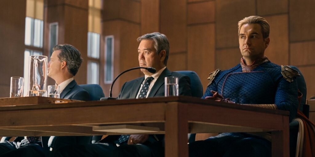 Homelander sitting in a courtroom with his two attorneys in The Boys Season 4, Episode 1 | Agents of Fandom