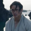 Manny Jacinto's Sith Lord stands brooding by a pond in Star Wars' The Acolyte | Agents of Fandom