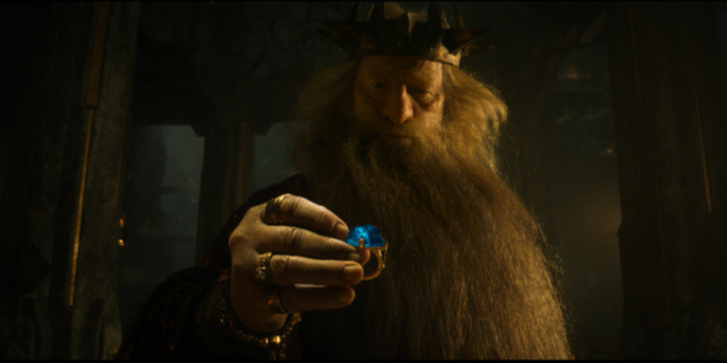 Peter Mullan as King Durin holding one of the rings of power in The Lord of the Rings: The Rings of Power Season 2 | Agents of Fandom