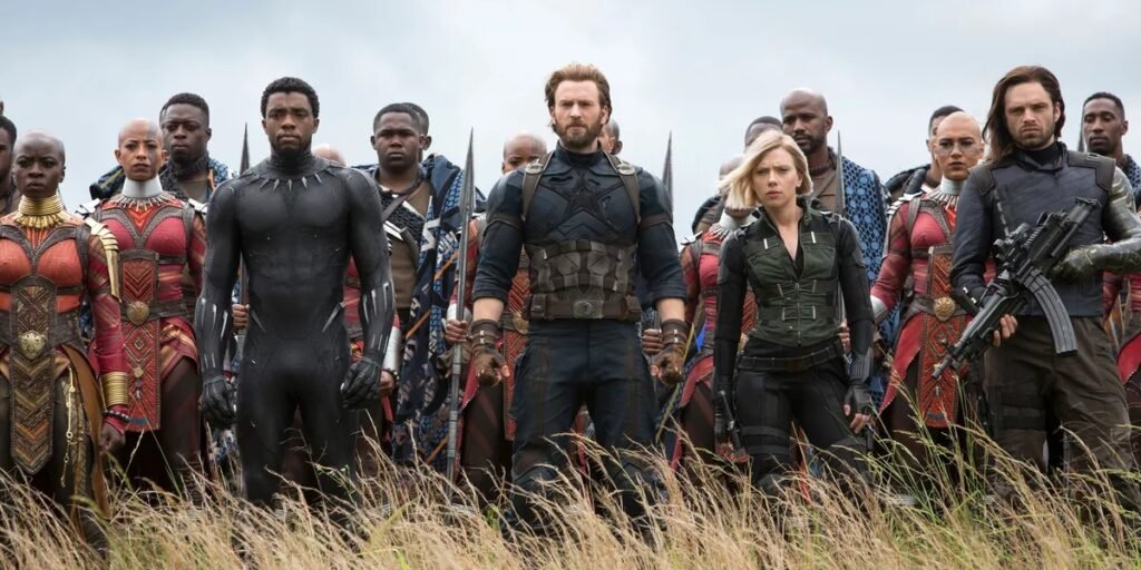 From left: The characters Black Panther (Chadwick Boseman, Captain America (Chris Evans), Black Widow (Scarlett Johansson), and The Winter Soldier (Sebastian Stan) prepare for battle on a grassy plain in Avengers: Infinity War. | Agents Of Fandom