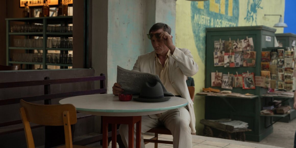 Daniel Craig looking down at a newspaper in Luca Guadagnino's Queer | Agents of Fandom