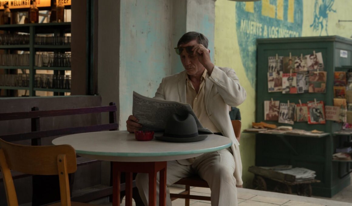 Daniel Craig looking down at a newspaper in Luca Guadagnino's Queer | Agents of Fandom