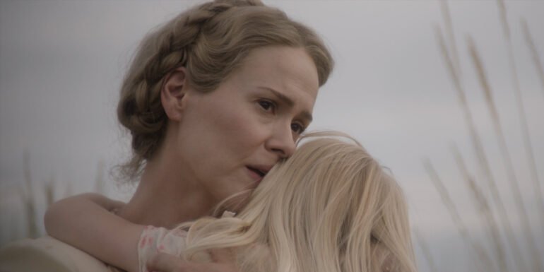 Margaret Bellum (Sarah Paulson) looking concerned as she's carry her daughter, Ollie Bellum (Alona Jane Robbins) in Hold Your Breath | Agents of Fandom