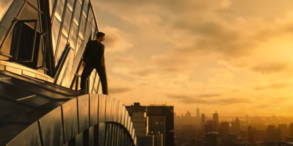 Adam Driver on the edge of a building under a bright orange sky in Megalopolis | Agents of Fandom