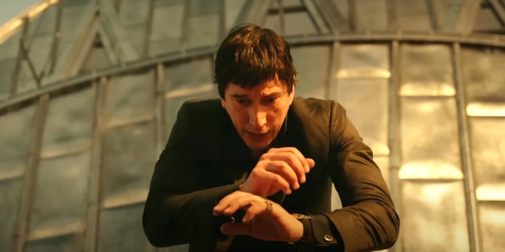 Adam Driver with his hands out in front of him as he lingers on a building in Megalopolis | Agents of Fandom