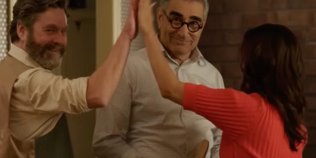 Zach Galifianakis, Eugene Levy and Eva Longoria celebrate with a high five in Only Murders in the Building Season 4 Episode 3 "Two for the Road" | Agents of Fandom