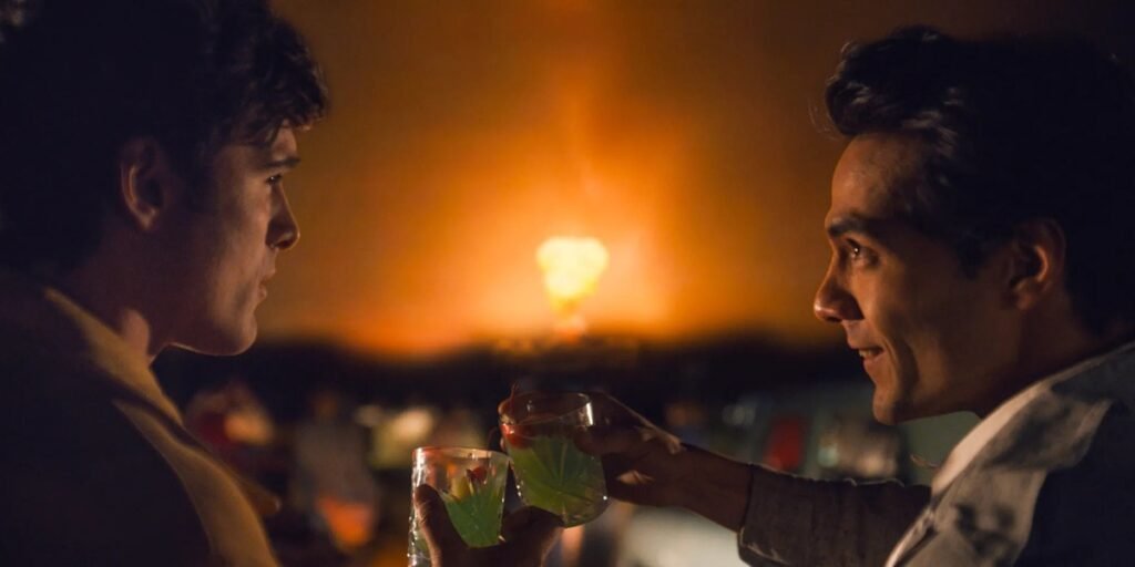 Jacob Elordi and Diego Calva look at each other while clinking their drinks together | Agents of Fandom