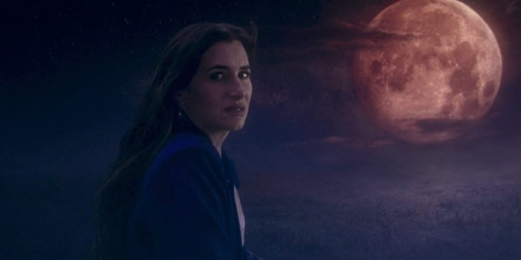 Agatha Harkness flies on a broom in front of a blood moon in Agatha All Along Episode 5 | Agents of Fandom