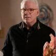 Steve Martin holding a doll in Only Murders in the Building Season 4 | Agents of Fandom