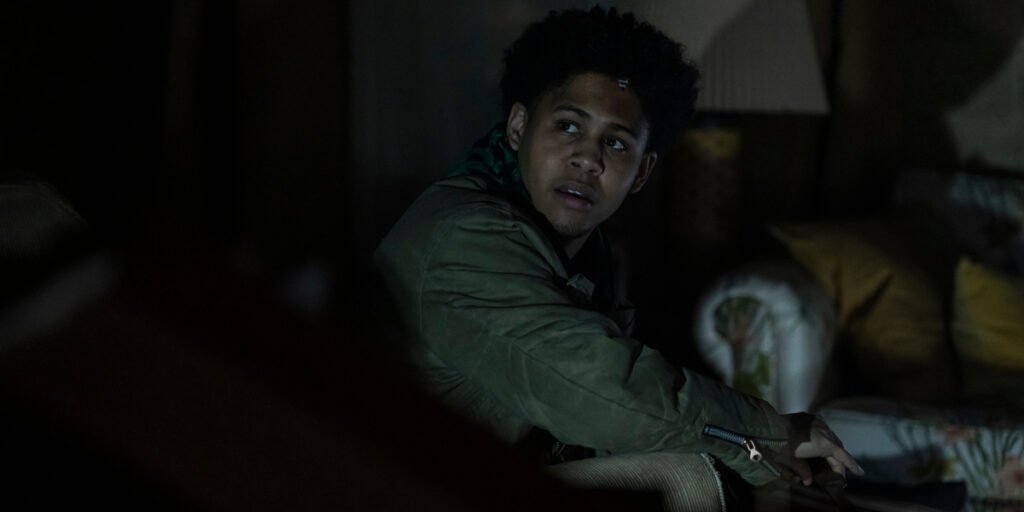 Rhenzy Feliz looking shocked as Victor Aguilar wtih a knife in his hand in The Penguin Episode 5 | Agents of Fandom