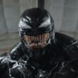 Venom (Tom Hardy) gives a big smile as he's about to face some foes in Venom: The Last Dance | Agents of Fandom