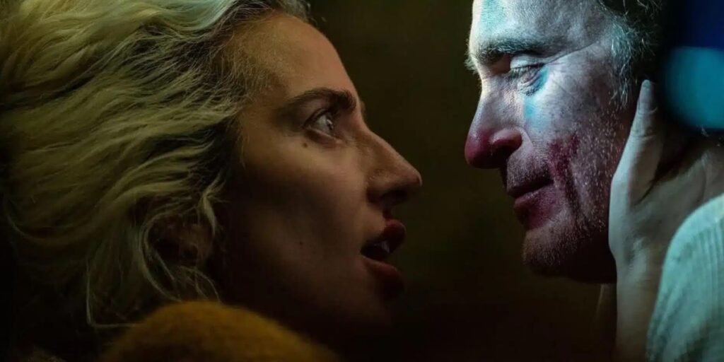 Lady Gaga holding Joaquin Phoenix's face in Joker: Folie à Deux | Agents of Fandom