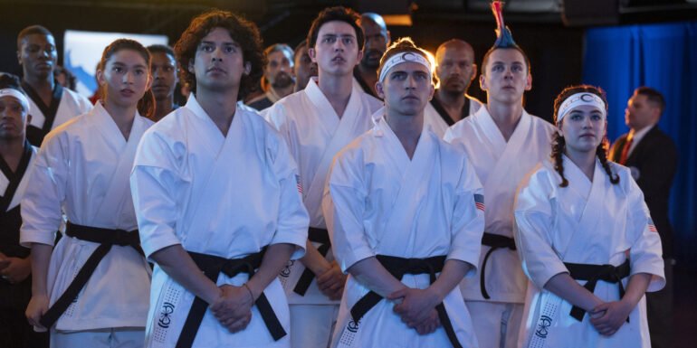 Miyagi-Do students standing with their hands crossed dressed in their karate uniforms for Cobra Kai | Agents of Fandom