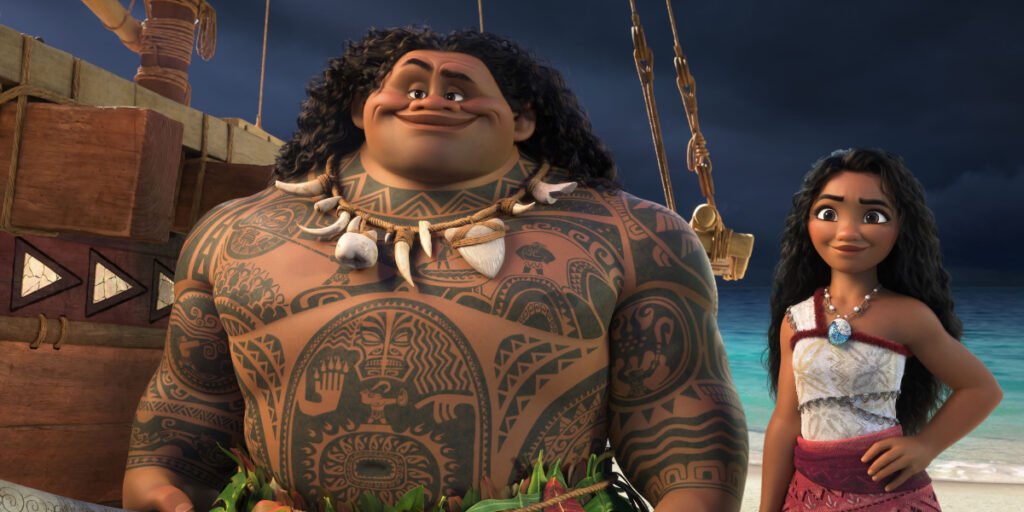 Maui (Dwayne Johnson) and Moana (Auliʻi Cravalho) smiling on a beach in Moana 2 | Agents of Fandom