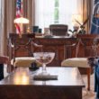 President Cal Bradford (James Marsden) sitting across Xavier Collins (Sterling K. Brown) in the Oval Office in Paradise | Agents of Fandom