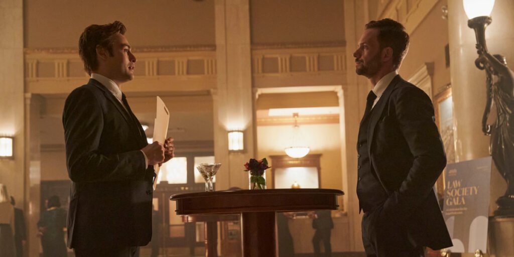 Werther (Douglas Booth) holding a file while talking to an angry Albert (Patrick J. Adams) in Young Werther | Agents of Fandom