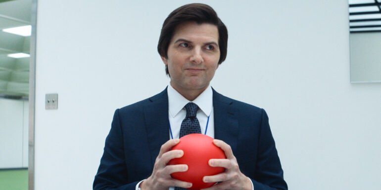 Adam Scott holding a red ball in Severance Season 2 | Agents of Fandom