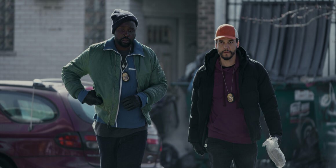 Brian Tyree Henry and Wagner Moura walking with badges on in Apple TV+'s Dope Thief | Agents of Fandom