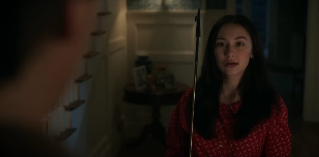 Belly (Lola Tung) looks in awe as Conrad (Chris Briney) is at the door.| Agents of Fandom 