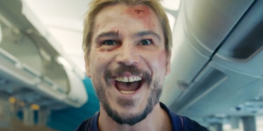 Josh Hartnett, bloodied on his face, stares straight forward with his mouth gaping as the opportunity for more battle presents itself.  I Agents of Fandom