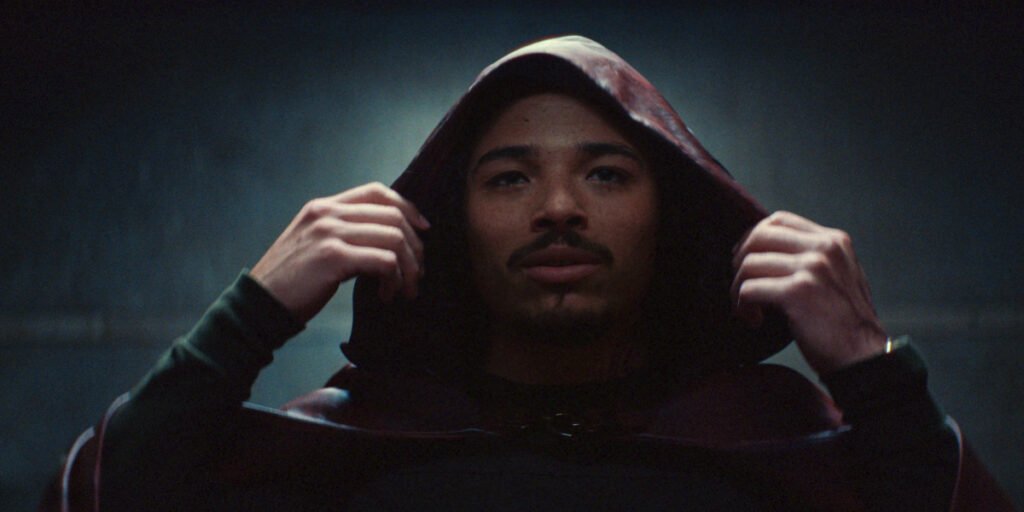 Anthony Ramos' Parker Robbins touching his hood in Ironheart | Agents of Fandom