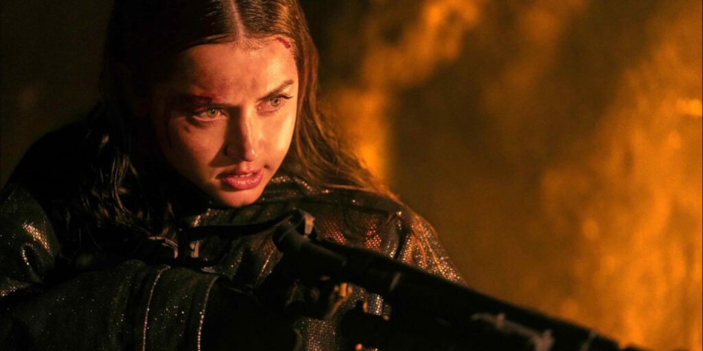 Ana de Armas as Eve holding a flamethrower in Ballerina | Agents of Fandom