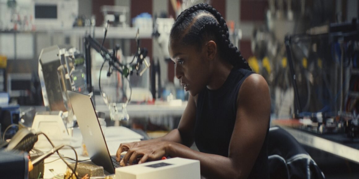 Dominique Thorne as Riri Williams in her suit destroying a truck in Ironheart