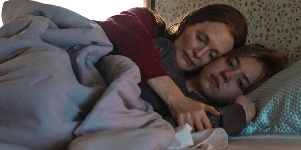 Mother and daughter hold each other in bed, with Julianne Moore arms wrapping around Sydney Sweeney's body, and test the power of familiar love. | Agents of Fandom
