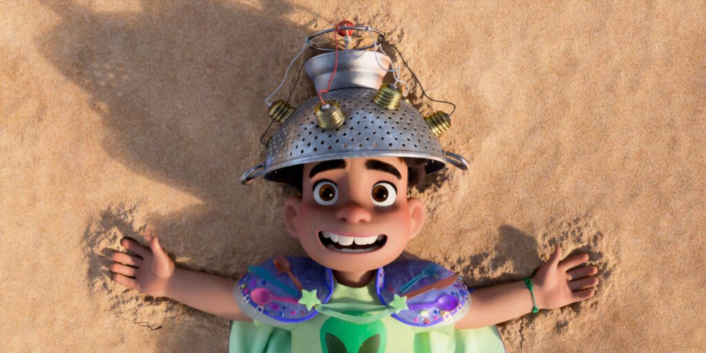 Elio laying on the beach wearing a strainer as a helmet | Agents of Fandom