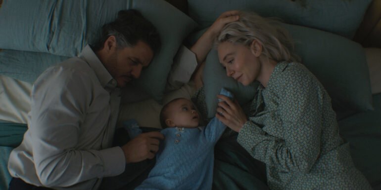 Reed Richards, Franklin Richards, and Sue Storm in bed in The Fantastic Four: First Steps | Agents of Fandom