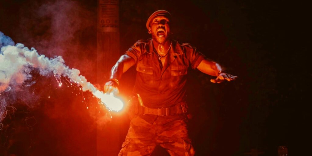 Mahershala Ali holding a flare in Jurassic World Rebirth | Agents of Fandom