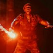 Mahershala Ali holding a flare in Jurassic World Rebirth | Agents of Fandom