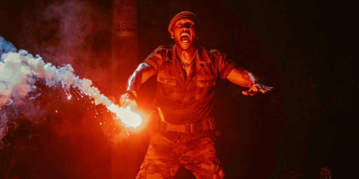 Mahershala Ali holding a flare in Jurassic World Rebirth | Agents of Fandom