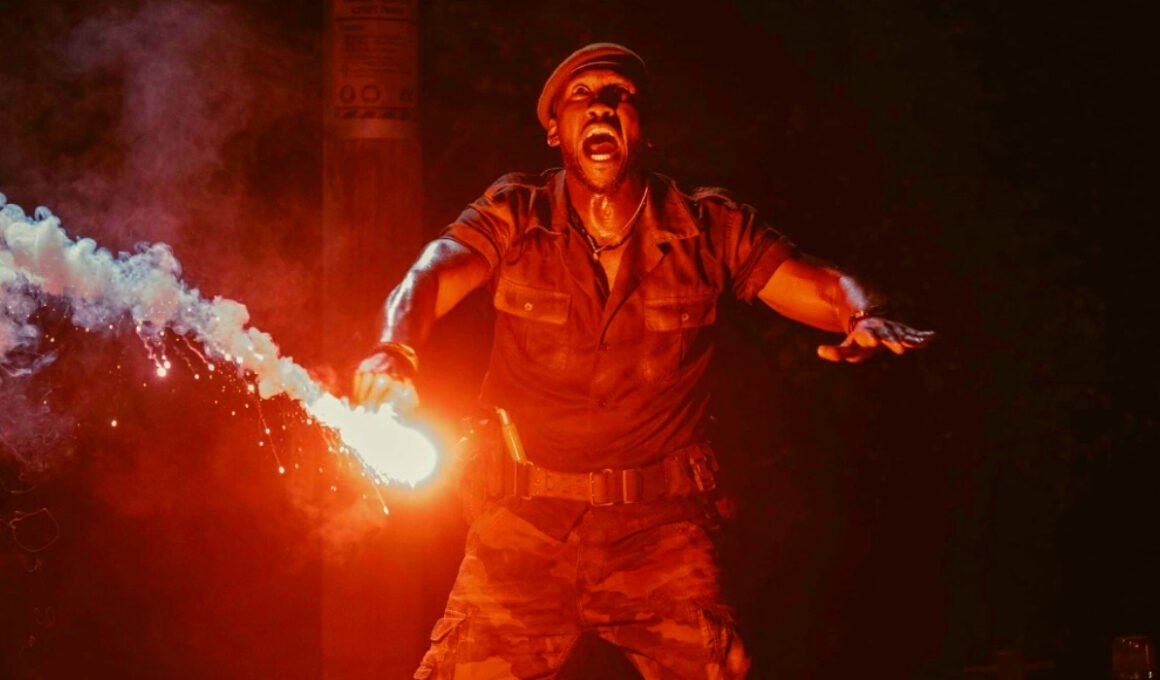 Mahershala Ali holding a flare in Jurassic World Rebirth | Agents of Fandom